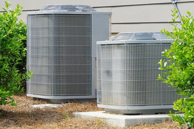 Air conditioning unit being checked while preforming home inspection services 